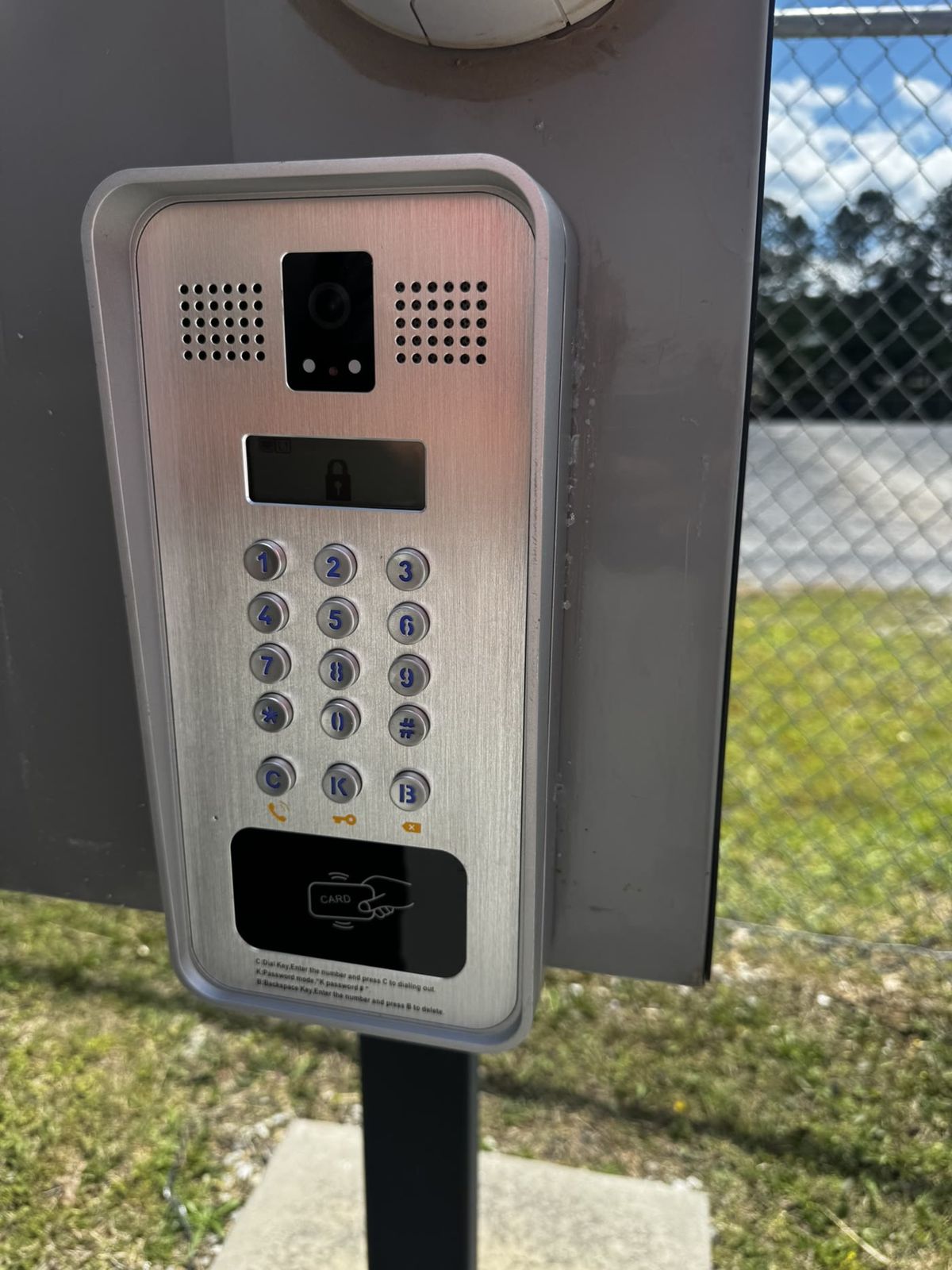 Close-up of stainless video intercom keypad with card reader
